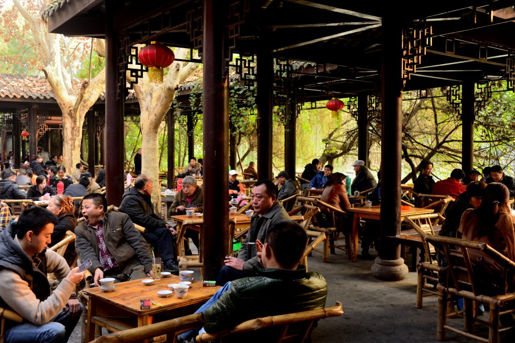 People drinking tea in the traditional teahouses inside Chengdu People's Park